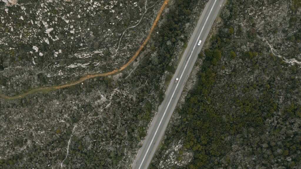 A road and surrounding landscape from above, showcasing the Kentucky Statewide Nadir and Oblique Image Viewer built on Esri technology