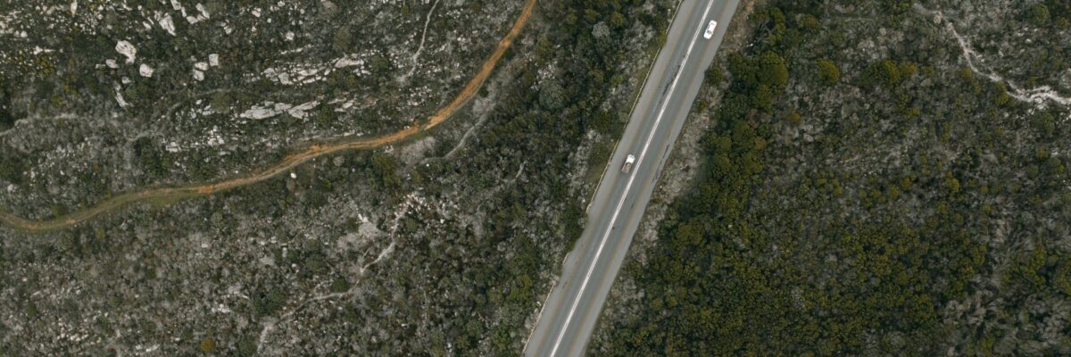 A road and surrounding landscape from above, showcasing the Kentucky Statewide Nadir and Oblique Image Viewer built on Esri technology