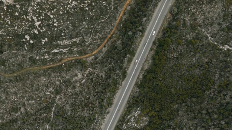 A road and surrounding landscape from above, showcasing the Kentucky Statewide Nadir and Oblique Image Viewer built on Esri technology
